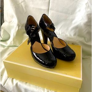 Michael Kors patent leather shoe. Barley there marks on the shoe.